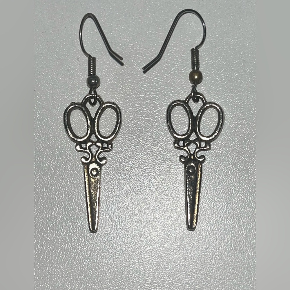 Silver scissor earrings.